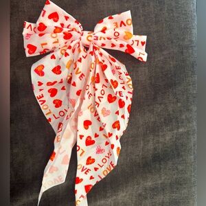Double bow with large tail on barrette closure- Love